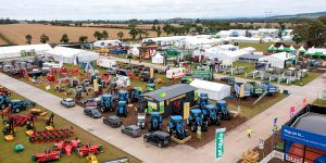 Field with tents and tractors