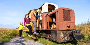 Kids playing around old train