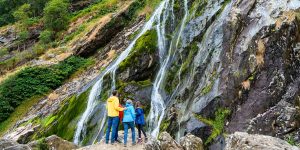 Family looking at waterfall
