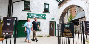 Couple walking out of the distillery
