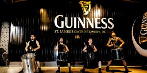 Drummers in front of the Guinness Sign