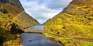 Stone Bridge, river, rainbow with mountains either side