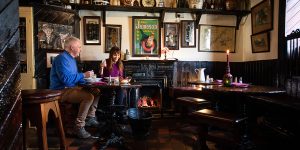 Couple chatting in a romantic Irish pub