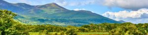 Lake, mountains and sky with white clouds