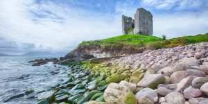 Castle on hill with shoreline